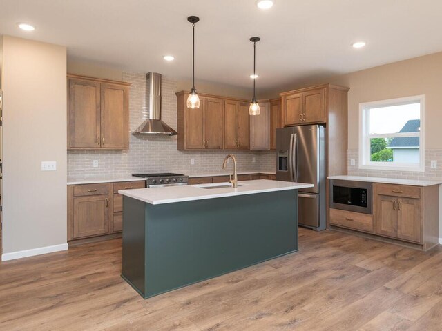 5393 177th St W, Lakeville, MN 55044 - kitchen with wall chimney range hood, stainless steel refrigerator with ice dispenser, a sink, built in microwave, and range