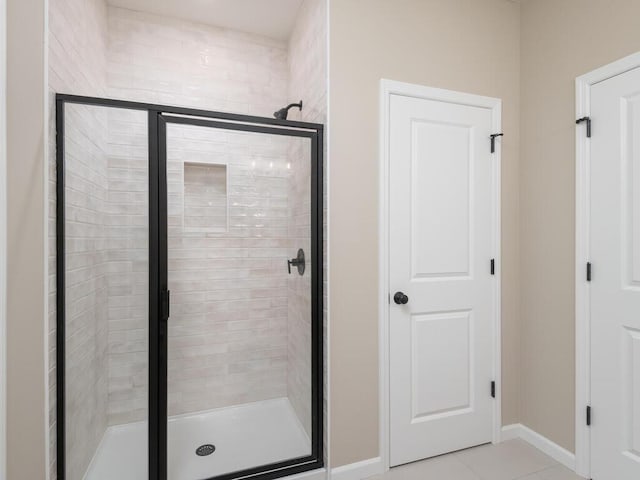 5393 177th St W, Lakeville, MN 55044 - full bath with a shower stall, tile patterned floors, and baseboards