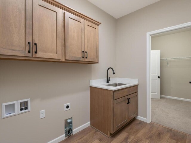 5393 177th St W, Lakeville, MN 55044 - laundry room featuring cabinet space, hookup for an electric dryer, washer hookup, wood finished floors, and baseboards