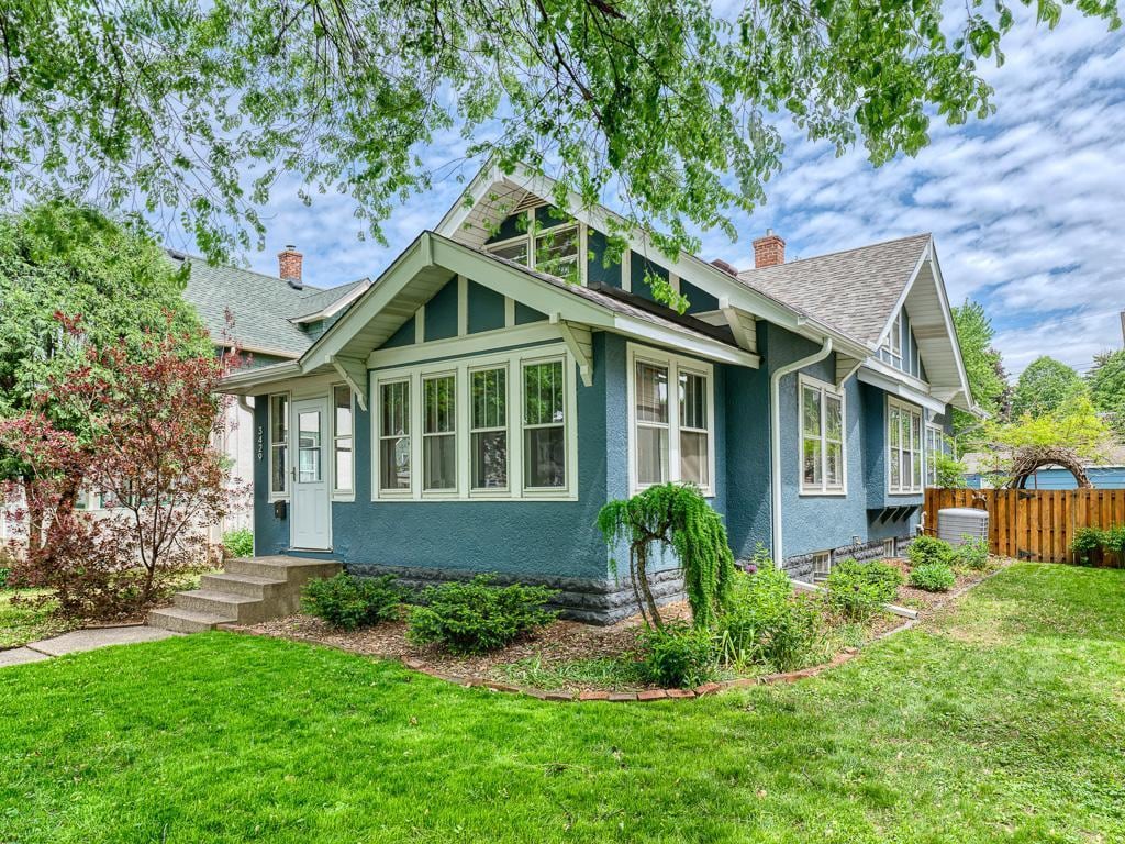 3429 31st Ave S, Minneapolis, MN 55406 - view of front of home with a chimney and a shingled roof