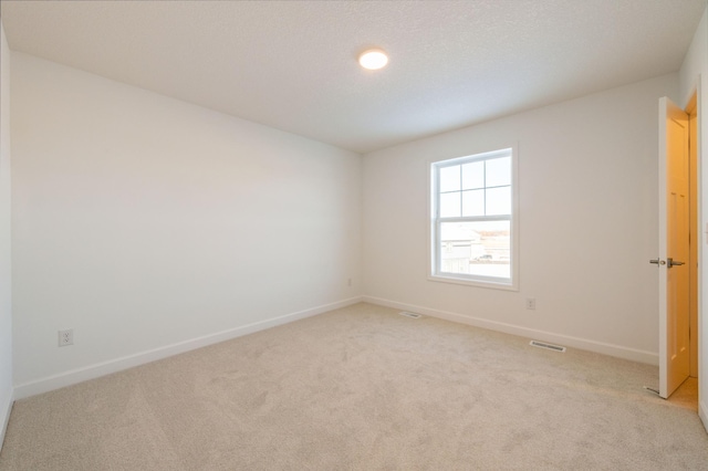 20098 67th Ave, Corcoran, MN 55340 - spare room featuring light carpet and baseboards