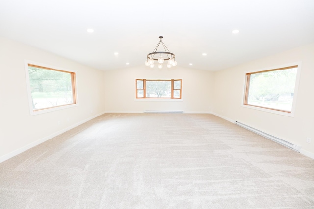 1202 Ridgeview Ter NE, Alexandria, MN 56308 - spare room featuring a baseboard radiator, a baseboard heating unit, lofted ceiling, light colored carpet, and a chandelier