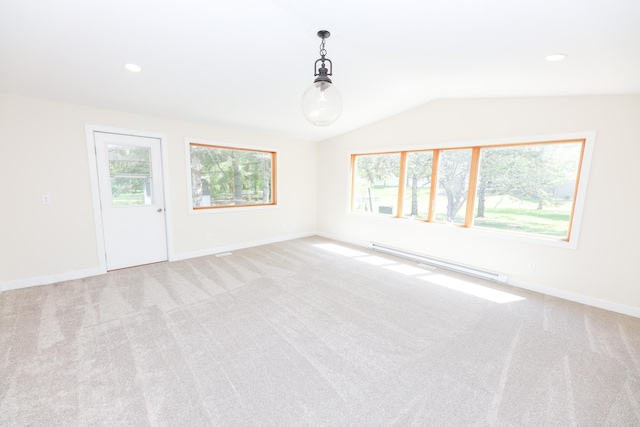 1202 Ridgeview Ter NE, Alexandria, MN 56308 - empty room with a baseboard heating unit, carpet flooring, healthy amount of natural light, vaulted ceiling, and recessed lighting