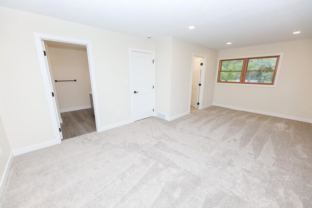 1202 Ridgeview Ter NE, Alexandria, MN 56308 - spare room featuring carpet flooring, recessed lighting, and baseboards