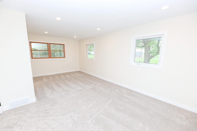 1202 Ridgeview Ter NE, Alexandria, MN 56308 - spare room with light carpet, recessed lighting, and baseboards