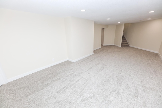 1202 Ridgeview Ter NE, Alexandria, MN 56308 - finished basement with light carpet, recessed lighting, stairs, and baseboards