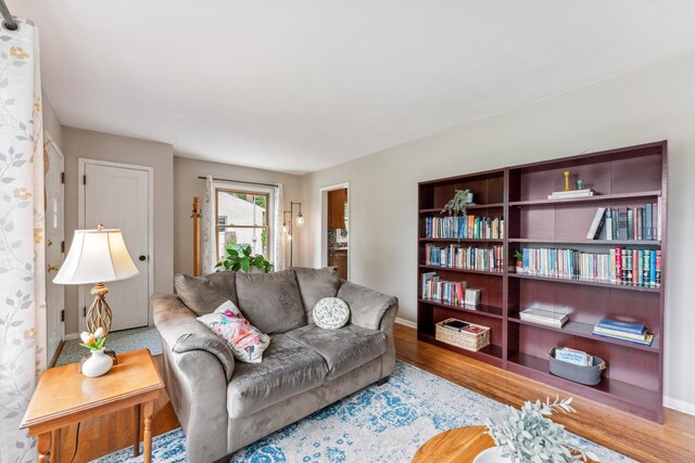 2918 Asbury St, Roseville, MN 55113 - living area featuring baseboards and wood finished floors
