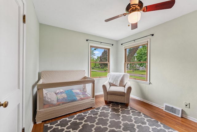 2918 Asbury St, Roseville, MN 55113 - bedroom with baseboards, wood finished floors, and ceiling fan