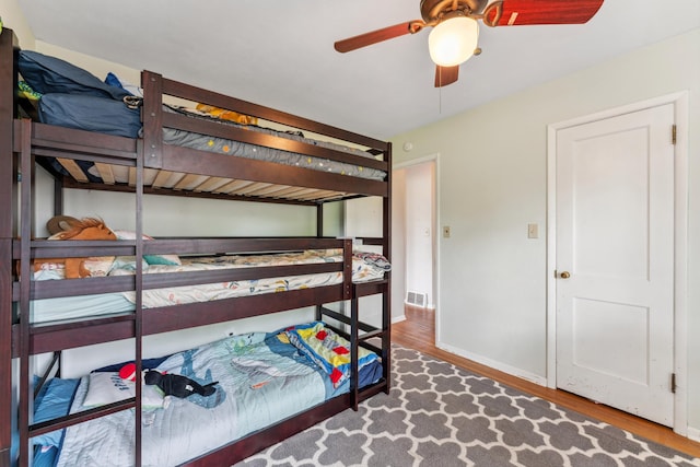 2918 Asbury St, Roseville, MN 55113 - bedroom with wood finished floors, baseboards, and ceiling fan