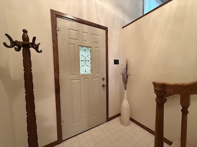1646 5th St, Montevideo, MN 56265 - entrance foyer featuring baseboards, light tile patterned floors, and plenty of natural light