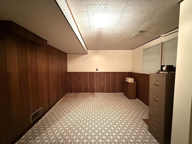 1646 5th St, Montevideo, MN 56265 - finished below grade area with wooden walls and a wainscoted wall