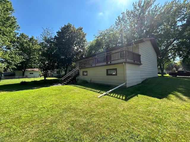1646 5th St, Montevideo, MN 56265 - back of house featuring a lawn and stairs