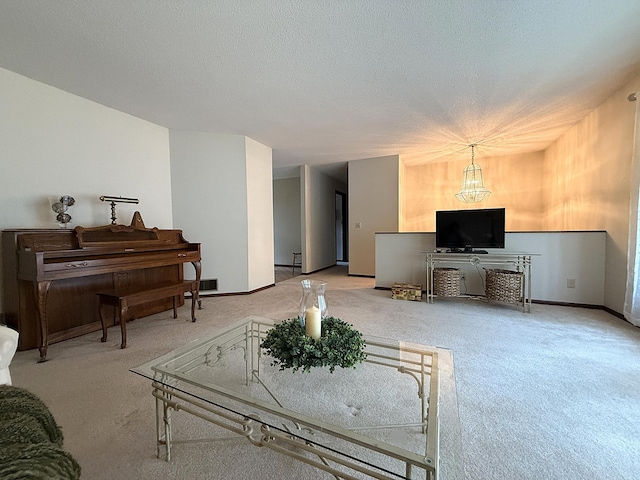 1646 5th St, Montevideo, MN 56265 - living area featuring carpet, a chandelier, baseboards, and a textured ceiling