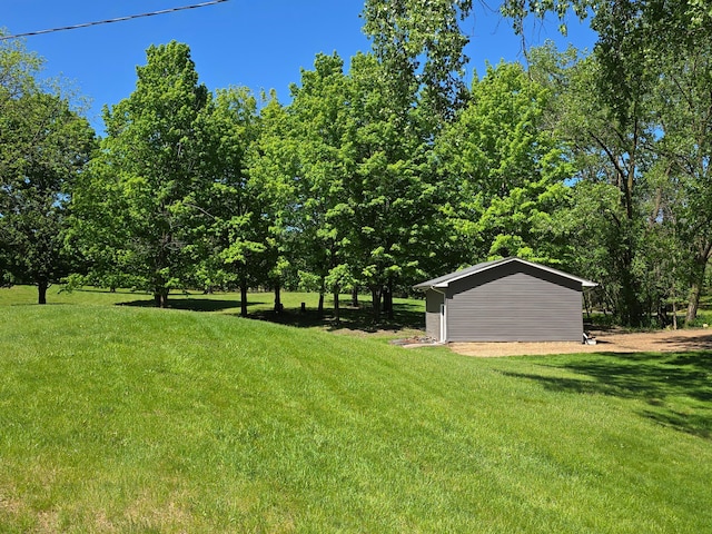 4230 Odegard Ave N, Baytown Twp, MN 55082 - view of grassy yard featuring an outdoor structure and a garage