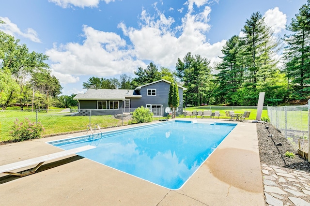 4230 Odegard Ave N, Baytown Twp, MN 55082 - view of pool featuring a diving board, a patio area, and view of scattered trees