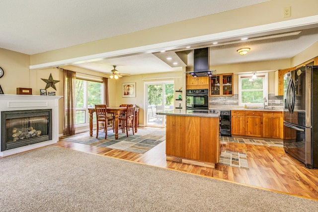 4230 Odegard Ave N, Baytown Twp, MN 55082 - kitchen with fridge with ice dispenser, oven, a sink, brown cabinets, and light wood-style floors