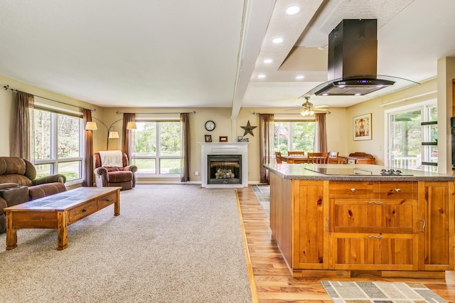 4230 Odegard Ave N, Baytown Twp, MN 55082 - kitchen featuring open floor plan, island exhaust hood, plenty of natural light, recessed lighting, and a fireplace