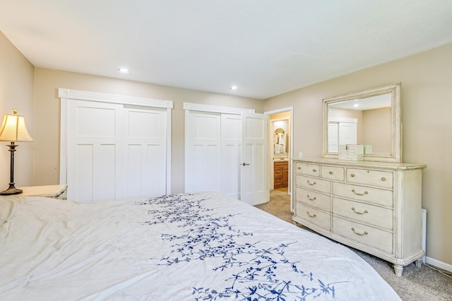4230 Odegard Ave N, Baytown Twp, MN 55082 - bedroom with light colored carpet, two closets, connected bathroom, recessed lighting, and baseboards