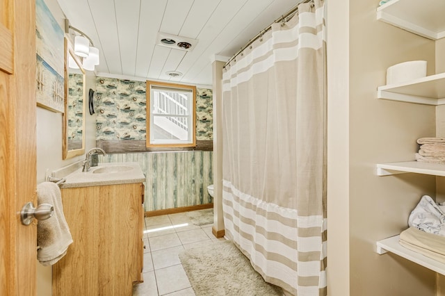 4230 Odegard Ave N, Baytown Twp, MN 55082 - full bathroom with wallpapered walls, baseboards, vanity, toilet, and tile patterned floors