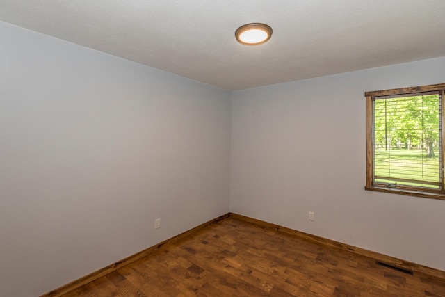 8296 Gladstone Lake Rd, Lake Edward Twp, MN 56401 - unfurnished room with dark wood finished floors and baseboards