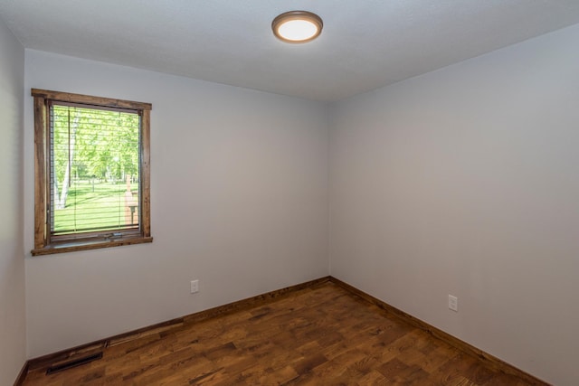 8296 Gladstone Lake Rd, Lake Edward Twp, MN 56401 - unfurnished room with dark wood-type flooring and baseboards