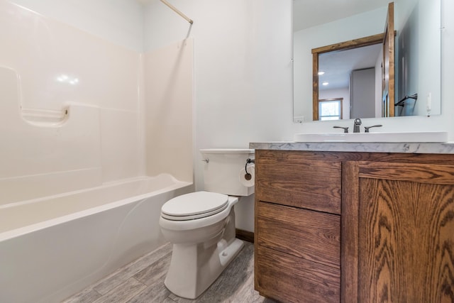 8296 Gladstone Lake Rd, Lake Edward Twp, MN 56401 - bathroom featuring toilet, vanity, bathtub / shower combination, and wood finished floors
