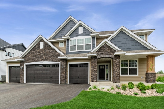 20117 63rd Ave, Corcoran, MN 55340 - craftsman inspired home with stone siding, driveway, an attached garage, and a front yard