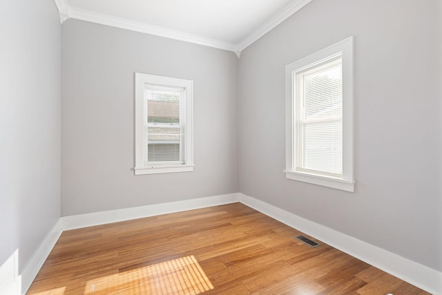 1001 2nd Ave SW, Austin, MN 55912 - unfurnished room featuring crown molding, light wood finished floors, and baseboards