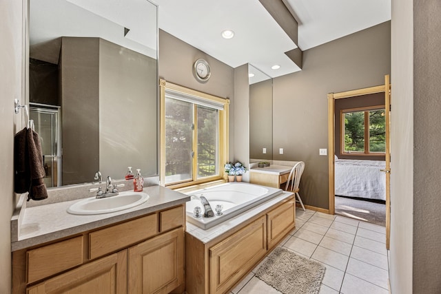5160 202nd Ln NE, Linwood Twp, MN 55092 - bathroom featuring vanity, a garden tub, tile patterned flooring, ensuite bath, and baseboards