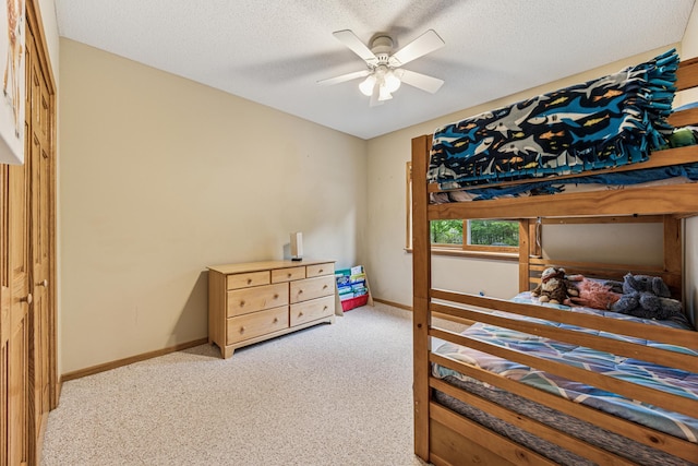 5160 202nd Ln NE, Linwood Twp, MN 55092 - bedroom featuring carpet, baseboards, a textured ceiling, and a ceiling fan