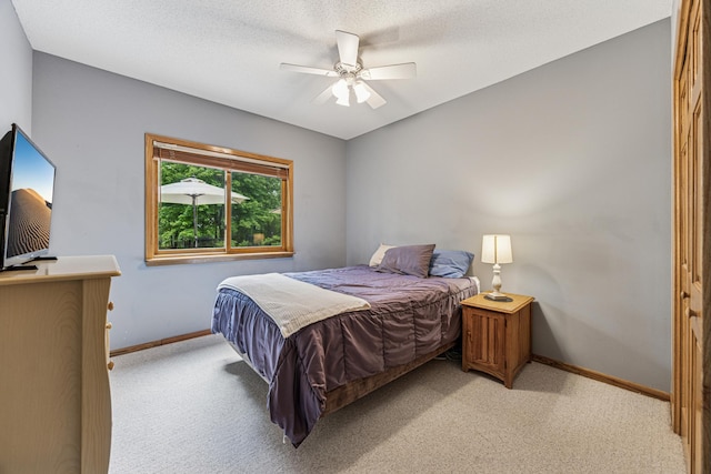5160 202nd Ln NE, Linwood Twp, MN 55092 - bedroom with light colored carpet, baseboards, and ceiling fan