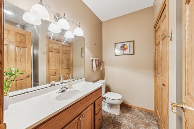 5160 202nd Ln NE, Linwood Twp, MN 55092 - bathroom with toilet, vanity, baseboards, and stone finish floors