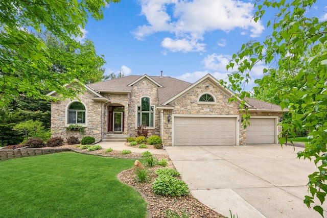 5160 202nd Ln NE, Linwood Twp, MN 55092 - view of front of house featuring a front lawn, a garage, driveway, roof with shingles, and stone siding