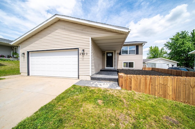 4703 7th St NW, Rochester, MN 55901 - view of front facade featuring a garage and concrete driveway