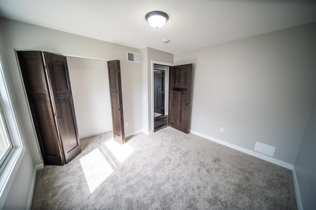 4703 7th St NW, Rochester, MN 55901 - unfurnished bedroom with light colored carpet and baseboards