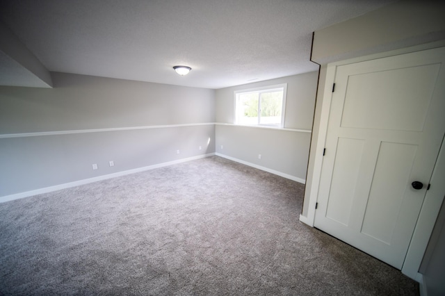 4703 7th St NW, Rochester, MN 55901 - basement featuring carpet floors and baseboards