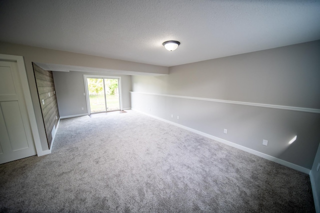 4703 7th St NW, Rochester, MN 55901 - spare room with carpet, baseboards, and a textured ceiling