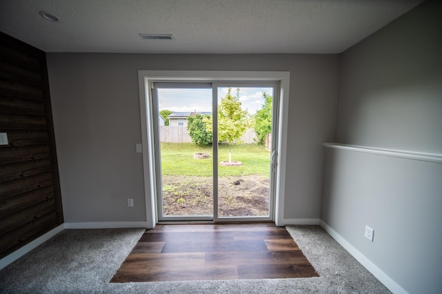 4703 7th St NW, Rochester, MN 55901 - carpeted empty room with baseboards and a textured ceiling