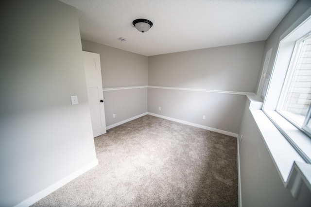 4703 7th St NW, Rochester, MN 55901 - carpeted empty room with baseboards
