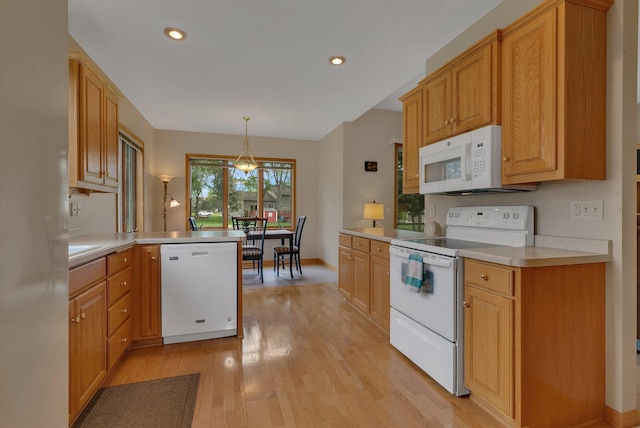 1538 Katrina Ct, Saint Cloud, MN 56301 - kitchen with white appliances, light wood-type flooring, light countertops, recessed lighting, and a peninsula