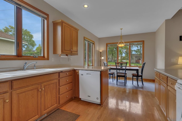 1538 Katrina Ct, Saint Cloud, MN 56301 - kitchen featuring white dishwasher, a sink, light wood-style floors, light countertops, and recessed lighting