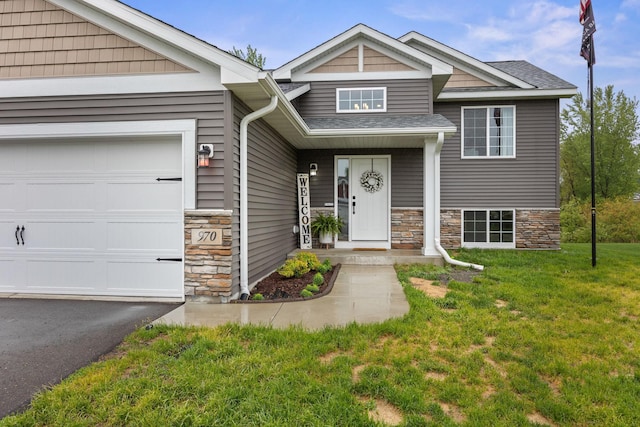 970 Acacia Dr S, Annandale, MN 55302 - view of front of property with stone siding, a front yard, a garage, and a shingled roof