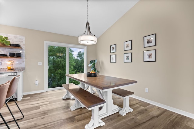 970 Acacia Dr S, Annandale, MN 55302 - dining area with vaulted ceiling, light wood finished floors, and baseboards