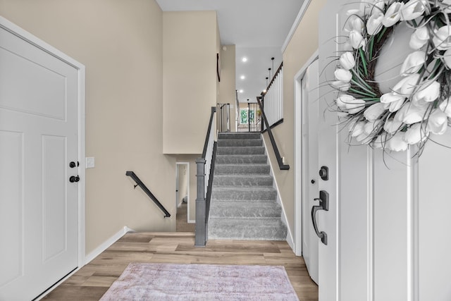 970 Acacia Dr S, Annandale, MN 55302 - entrance foyer featuring wood finished floors, baseboards, and stairway