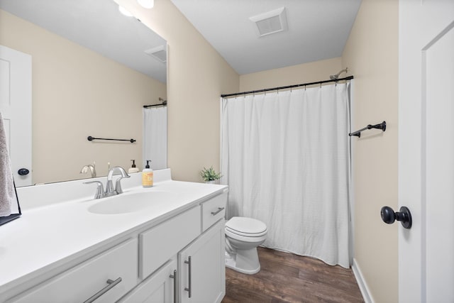 970 Acacia Dr S, Annandale, MN 55302 - full bathroom featuring wood finished floors, vanity, toilet, and a shower with curtain