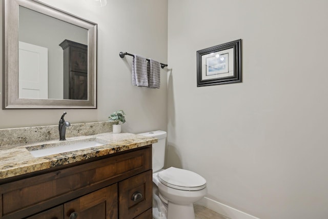 15653 Cobblestone Lake Pkwy, Apple Valley, MN 55124 - bathroom with vanity, toilet, tile patterned floors, and baseboards