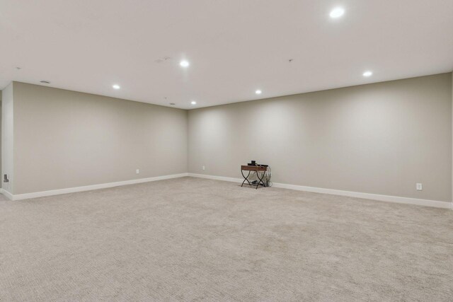 15653 Cobblestone Lake Pkwy, Apple Valley, MN 55124 - unfurnished room with recessed lighting, light colored carpet, and baseboards