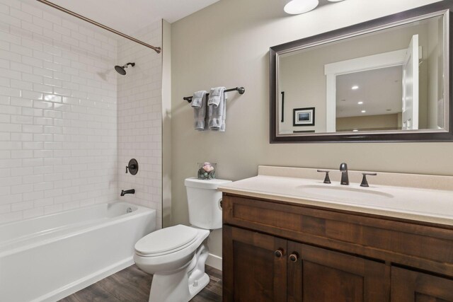 15653 Cobblestone Lake Pkwy, Apple Valley, MN 55124 - full bathroom featuring wood finished floors, vanity, toilet, and shower / bath combination