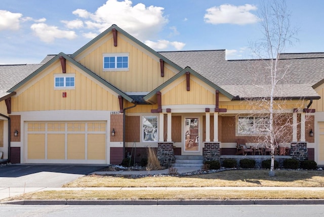 15653 Cobblestone Lake Pkwy, Apple Valley, MN 55124 - craftsman inspired home with roof with shingles, asphalt driveway, and a garage
