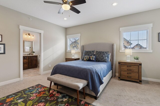 15653 Cobblestone Lake Pkwy, Apple Valley, MN 55124 - bedroom featuring light colored carpet, baseboards, multiple windows, connected bathroom, and recessed lighting